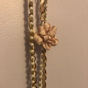 Long Gold Necklace with Bow and Pearl Design